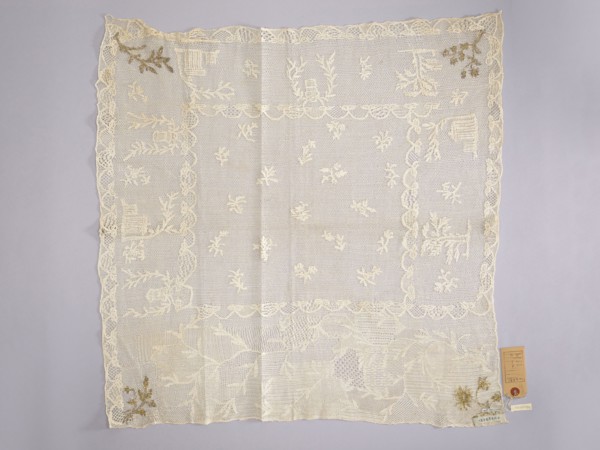 Tablecloth., Embroidered tablecloth: white embroidery on white mesh. In the center are projections