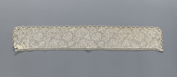 Fragment of bobbin lace with plant ornaments, 18th century, Flanders; width 7 cm, length 74 cm;