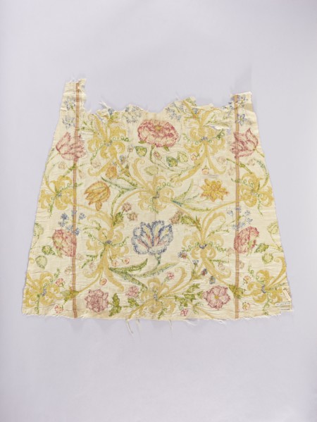 Two fragments of a dalmatic, front and back, of silk fabric interwoven with silver thread. The