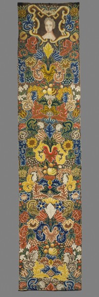 Tapestry embroidered in wool and silk on linen canvas. In the upper part, within a decorative