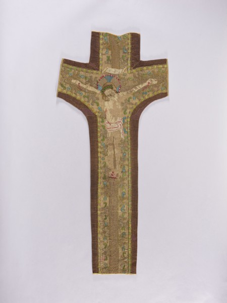Embroidered Y-shaped chasuble pretext with a depiction of Christ on the cross, surrounded by a