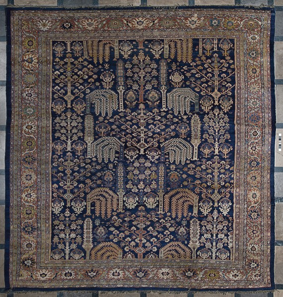 Carpet, The main field is filled with motifs of various species of trees arranged in three vertical