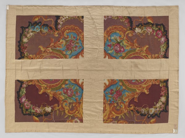 Ornamental tapestry, Cut from a larger piece; in the center, a bouquet of flowers in a medallion