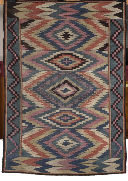 Kilim, Kilim with vertical stripes in rhombus motifs that merge concentrically into hexagons, their