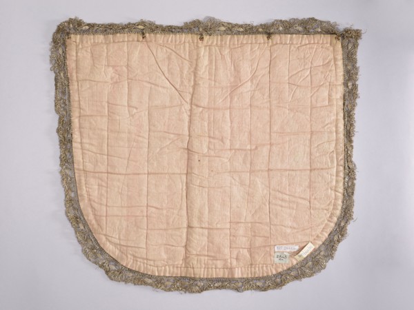 A hood from a church cope. The hood of the liturgical cope is made of navy blue silk with appliquéd