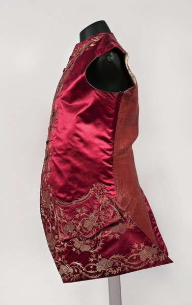 Men's vest made of cherry satin, embroidered. Straight cut, sleeveless and collarless. Diagonal