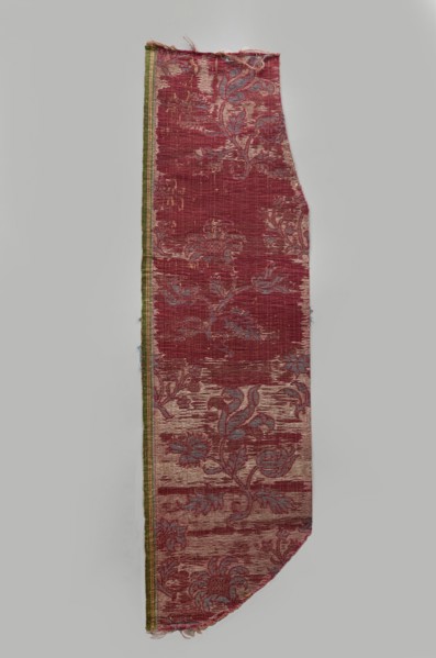 Fragment of fabric, silks, brocade, floral and plant patterns, double-warp brocade. On a white and