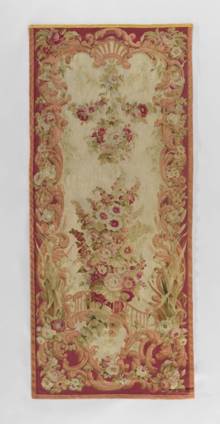 Figural tapestry, flowers, leaves, floral ornaments, garlands. In the center, a large bouquet of