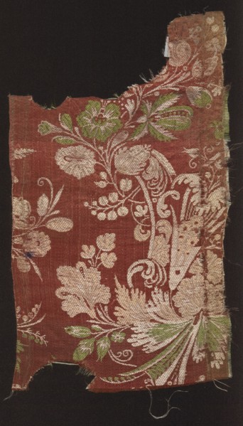 Fabric fragment. Fragments of silk patterned fabric with plant patterns; stripe decorated with