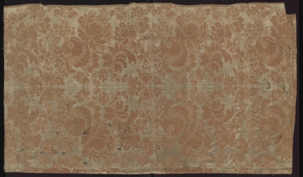 Fabric fragment. Fragment sewn from two salmon-white damask-type fabrics promoted stripes,