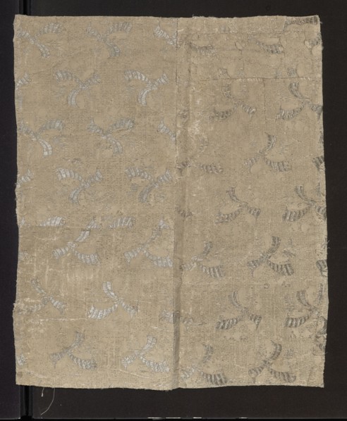 Fabric fragment, fragments of silk patterned fabric with preserved pattern. Fragment showing a