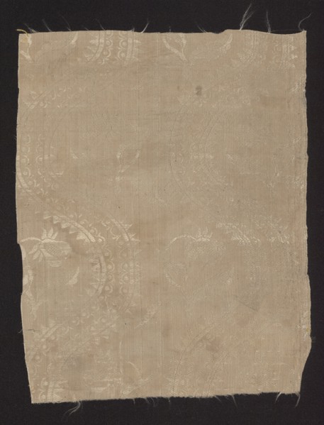 Fragment of silk fabric, damask with plain weave background and a lisere pattern, floral pattern,