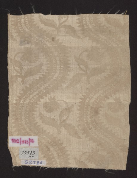 Fragment of silk fabric, patterned floral damask with plain weave background and lisere pattern;
