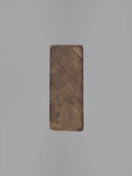 Double-sided gingerbread mould. Side A: bison; Side B: three figures—a bachelor in