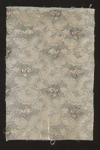 Fabric fragment, fragments of silk patterned fabric with floral patterns. Fragment of
