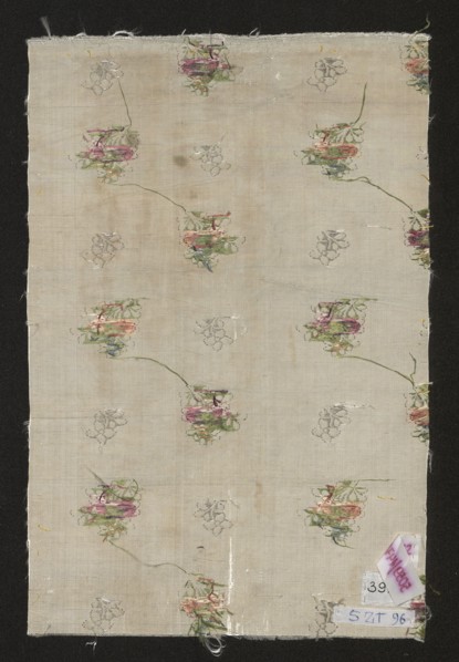 Fabric fragment. Fragment of silver-and-white silk fabric with miniature flower bouquets and floral