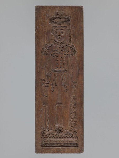 Double-sided gingerbread mould. Side A: image of a soldier; Side B: baby in swaddling clothes.,