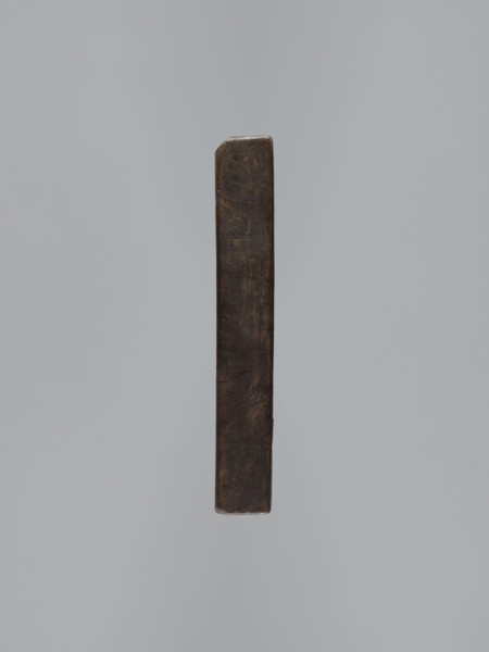 Double-sided gingerbread mould. Side A: female figure in a decorative bonnet and long patterned