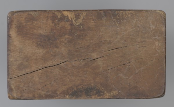 Double-sided gingerbread mould. Side A: figure of a lady in a decorative, pleated early