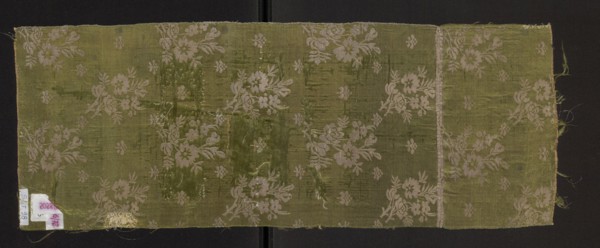Fragment of a solid silk fabric, patterned with two joined branches bearing unfolded roses and