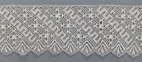 Lace fragment, bobbin lace. White, section of a strip with a pattern of diagonal stripes with