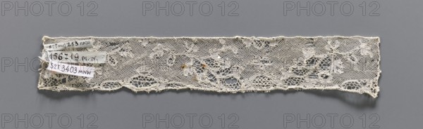 Lace fragment, bobbin lace, Valenciennes lace. Fragment of white bobbin lace with a continuous