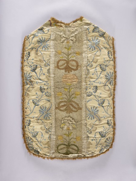 Chasuble. Chasuble with a column embroidered with colored silk with large, convex flowers on a