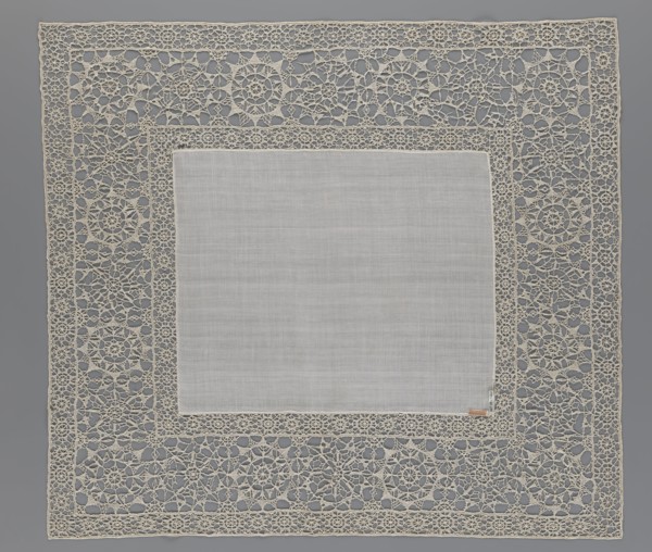 Doily, geometric ornaments, rosettes ornament, doily with smooth center. Edge made of white linen