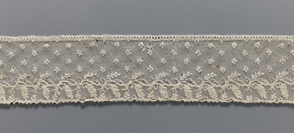 Fragment of lace, Alençon lace decorated with small twigs in projections and a tendril with