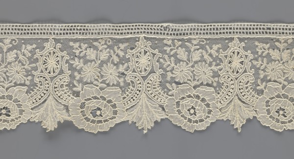 Lace fragment, purchase provenance; lace with plant ornaments. Serrated on one side, pattern of
