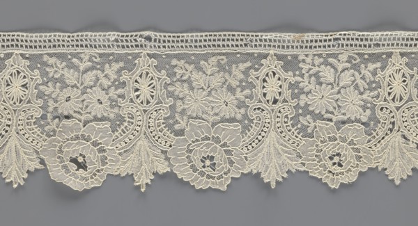 Lace fragment, lace with plant ornaments. Serrated on one side, with a pattern of flowers,