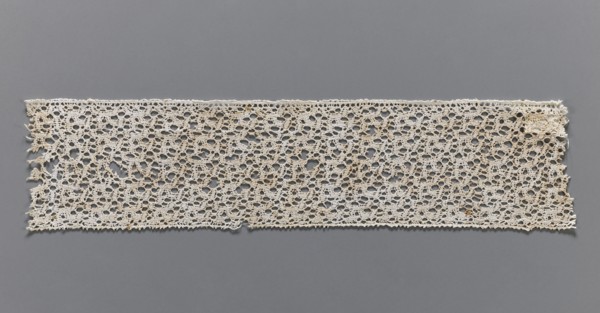 Lace fragment, bobbin lace, one edge finished with picots, 17th century, Flanders; width 6.5 cm,