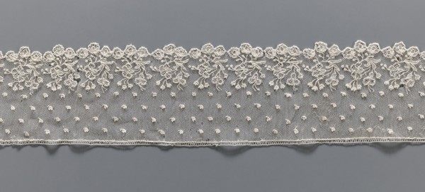 Lace fragment, needle lace Alençon style, 18th century, France. The edge features a broad floral
