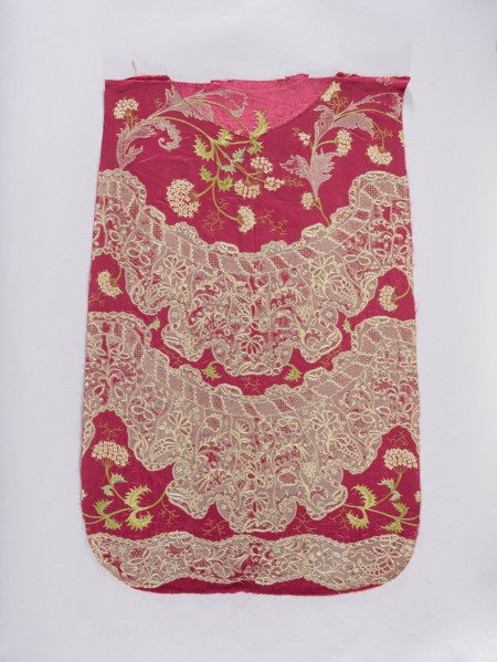 Back of a chasuble. Fragment of red amaranth satin fabric, embroidered; originally likely intended