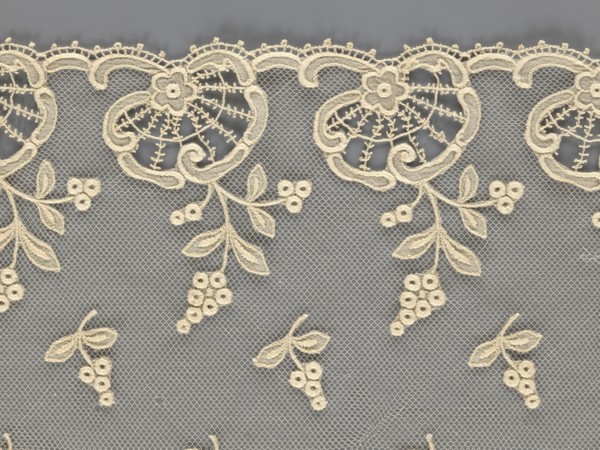 Fragment of lace, lace with plant ornaments, slightly serrated lower edge, featuring shell motifs