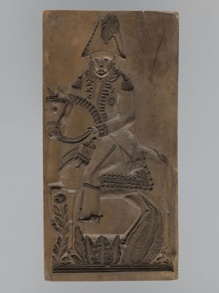 Gingerbread mold, double-sided. Obverse: image of a rider on a horse in a parade uniform from the