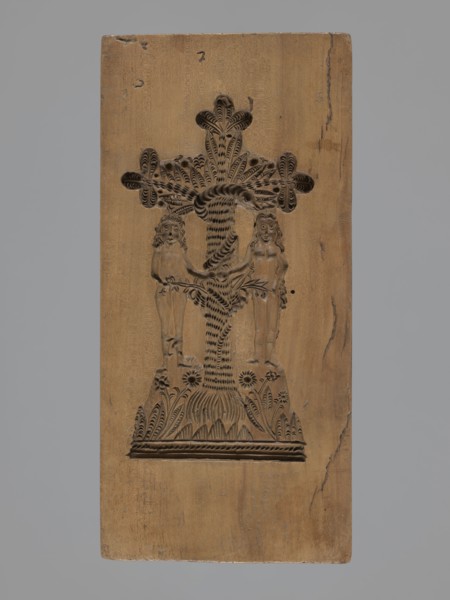 Double-sided gingerbread mould. Obverse: Adam and Eve in paradise—naked figures standing under the