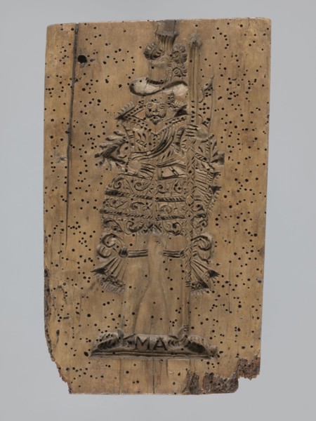 A single-sided gingerbread mold of rectangular shape with the image of a male figure in a richly
