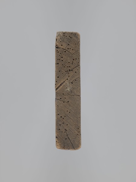A single-sided gingerbread mold of rectangular shape with the image of a male figure in a richly