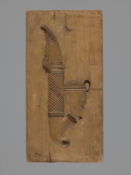 Double-sided gingerbread mould. Obverse: decorative pipe; reverse: nine fish. Double-sided