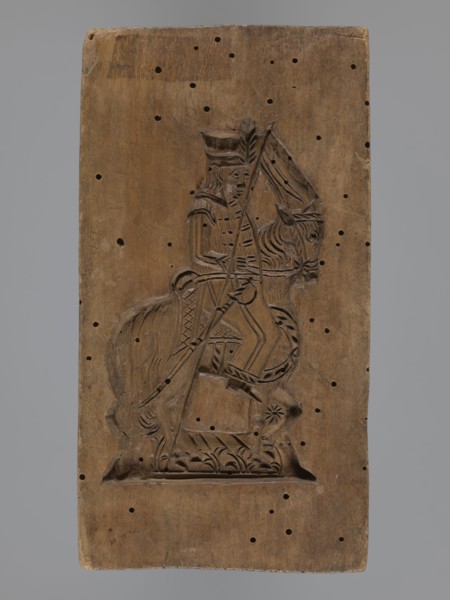 Double-sided gingerbread mould with the image of a rider on both sides, gingerbread; subject: