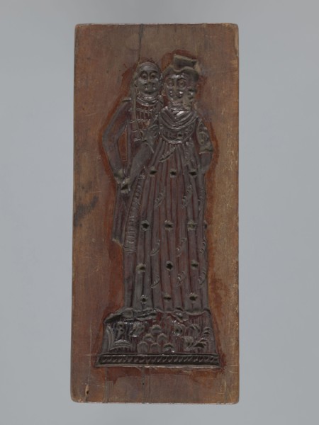 Double-sided gingerbread mold. Obverse: couple holding hands—woman in a richly decorated long dress