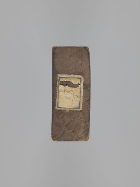 Double-sided gingerbread mold. Obverse: couple holding hands — a woman in a richly decorated long