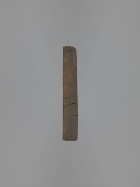 Double-sided gingerbread mould. Obverse: figure of a bearded man in patterned clothes, richly