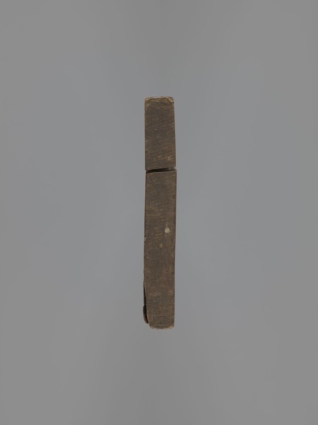 Double-sided gingerbread mould. Obverse: figure of a bearded man in patterned clothes, richly