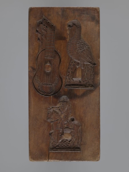 Double-sided rectangular gingerbread mold with three representations on each side. One side: