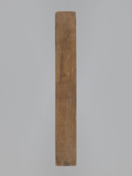 One-sided gingerbread form with the image of a rectangular floral and plant ornament. One-sided