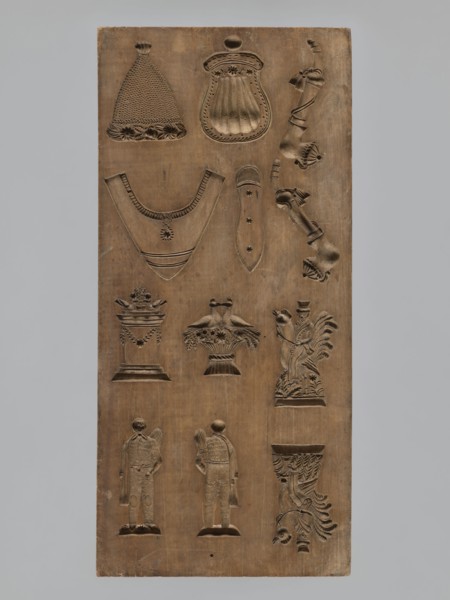 Double-sided gingerbread mould. Obverse: 16 images of various figures; reverse: 12 depictions.