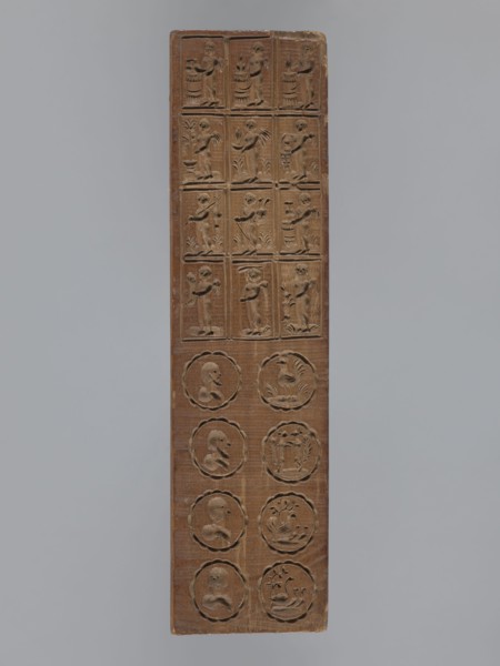 Double-sided gingerbread mould. Obverse: seven floral and plant motifs bouquets of roses and other