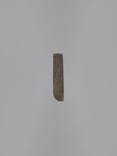 Double-sided gingerbread mould. Obverse: images of four heads that, depending on rotation of the